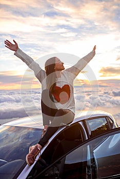 Woman enjoying beautiful cloudscape