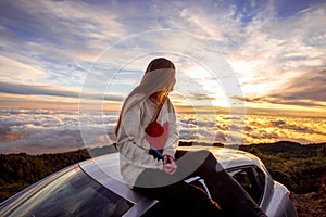 Woman enjoying beautiful cloudscape