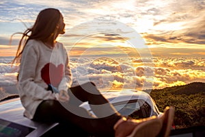 Woman enjoying beautiful cloudscape