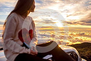 Woman enjoying beautiful cloudscape