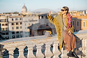 Woman enjoying beautiful morning cityscape of Rome