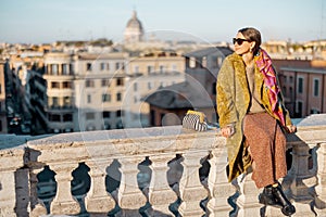 Woman enjoying beautiful morning cityscape of Rome