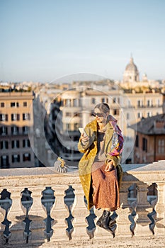 Woman enjoying beautiful morning cityscape of Rome