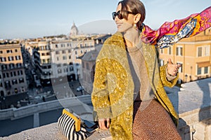 Woman enjoying beautiful morning cityscape of Rome