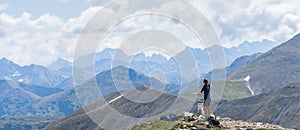 Woman enjoying beautiful view on mountain ranges from mountain summit, Slovakia, Europe