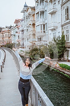 woman enjoying the beauty of building in arnavutkoy