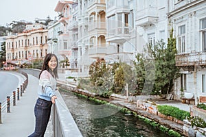 woman enjoying the beauty of building in arnavutkoy