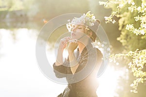 Woman enjoying blooming tree