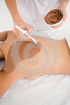 Woman enjoying a chocolate beauty treatment