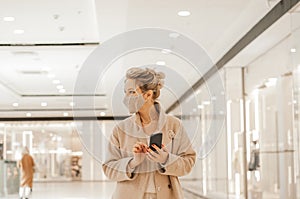 Woman enjoying the day in the shopping mall. with face mask. High quality photo. The Woman enjoying the day in the shopping mall. photo