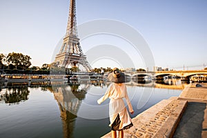 Woman enjoying Eiffel tower in Paris