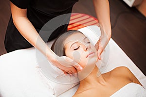 Woman enjoying a facial massage