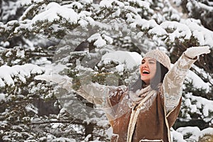 Woman enjoying the falling snow