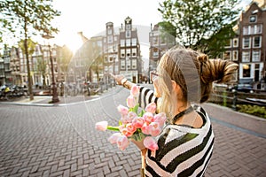 Woman with tulips in Amsterdam city