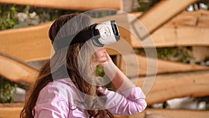 Woman enjoying looking through VR headse