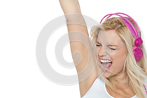 Woman enjoying loud music. Rock on
