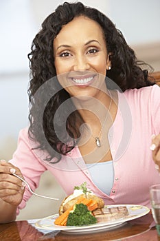 Woman Enjoying A Meal At Home