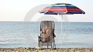 Woman enjoying morning sunbath near seashore.