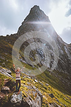 Woman enjoying mountain peak landscape travel hiking alone in Norway outdoor