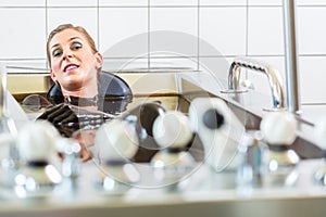 Woman enjoying mud bath alternative therapy