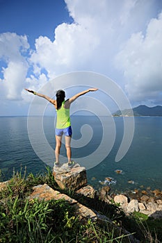 Woman enjoying nature with her opened arms