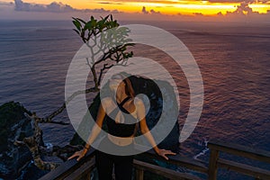 Woman Enjoying Ocean Sunset