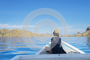 Woman enjoying Padar Island view from boat photo