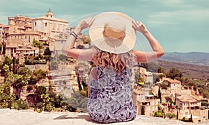 Woman enjoying panoramic view of Gordes village