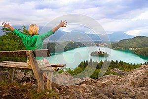 Woman enjoying panoramic view of Lake Bled, Slovenia.