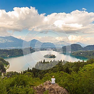 Woman enjoying panoramic view of Lake Bled, Slovenia.