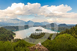 Woman enjoying panoramic view of Lake Bled, Slovenia.