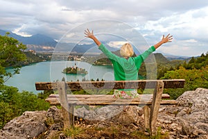 Woman enjoying panoramic view of Lake Bled, Slovenia.