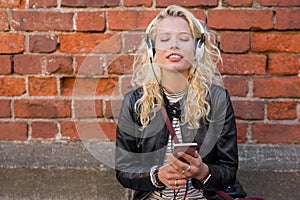 Woman enjoying peacefull music on her headphones