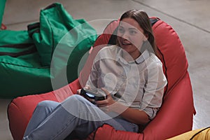 Woman enjoying playing video games