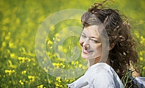 Woman enjoying in rapeseed field