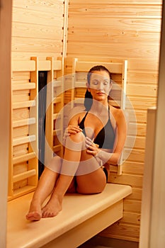 Woman enjoying sauna