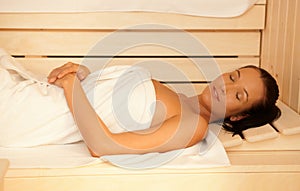 Woman enjoying sauna