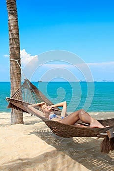 Woman enjoying the serenity of a tropical beach