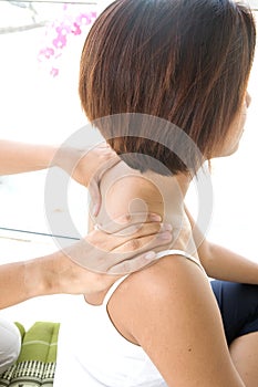 Woman enjoying shoulder rub from therapist