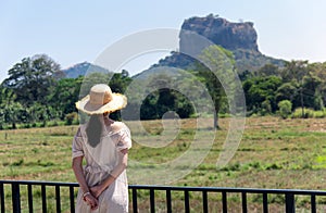 Woman with Sigiriya rock view in Sri Lanka
