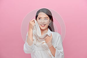 Woman enjoying the softness of a towel