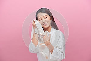 Woman enjoying the softness of a towel