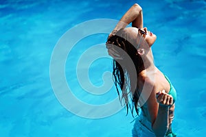 woman enjoying summer in pool