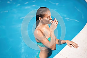 woman enjoying summer in pool