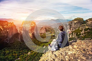 Woman enjoying sunrise on of mountain