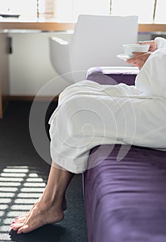 Woman enjoying tea in early morning