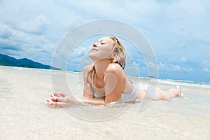 Woman enjoying on tropical beach