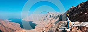 Woman enjoying view of Fjord Khor Najd in Musandam Oman