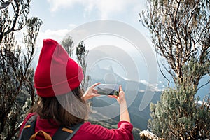 Woman enjoying view on the island while traveling in the mountains