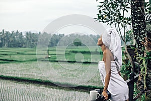 Woman enjoying view to rice fields on Bali